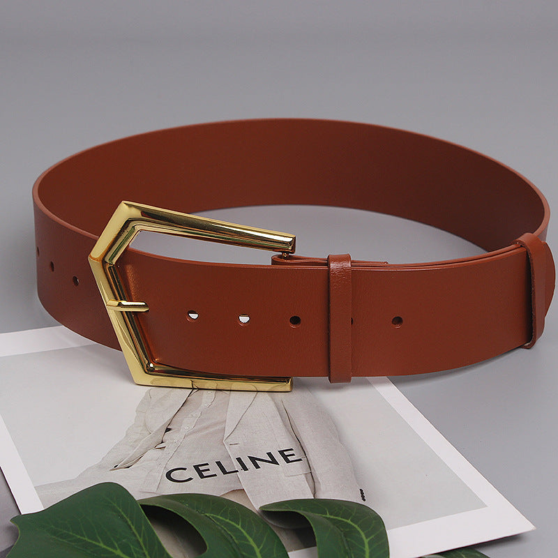 Grande ceinture large en peau de vache à boucle de goupille de forme concave