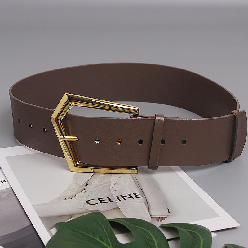 Grande ceinture large en peau de vache à boucle de goupille de forme concave
