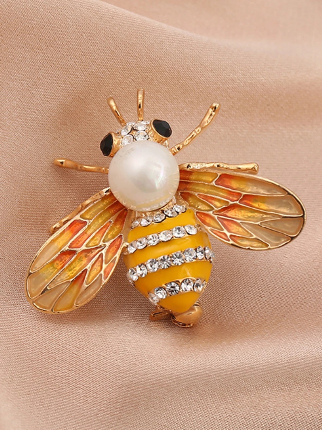 Broche abeille ornée de perles d'imitation