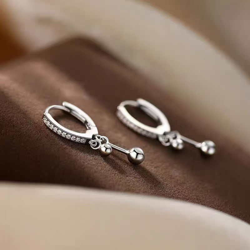 Boucles d'oreilles à double pompon
