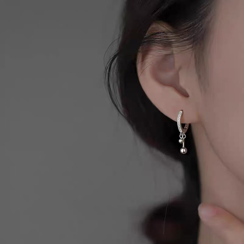 Boucles d'oreilles à double pompon