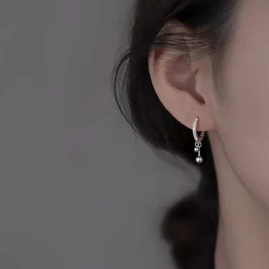 Boucles d'oreilles à double pompon